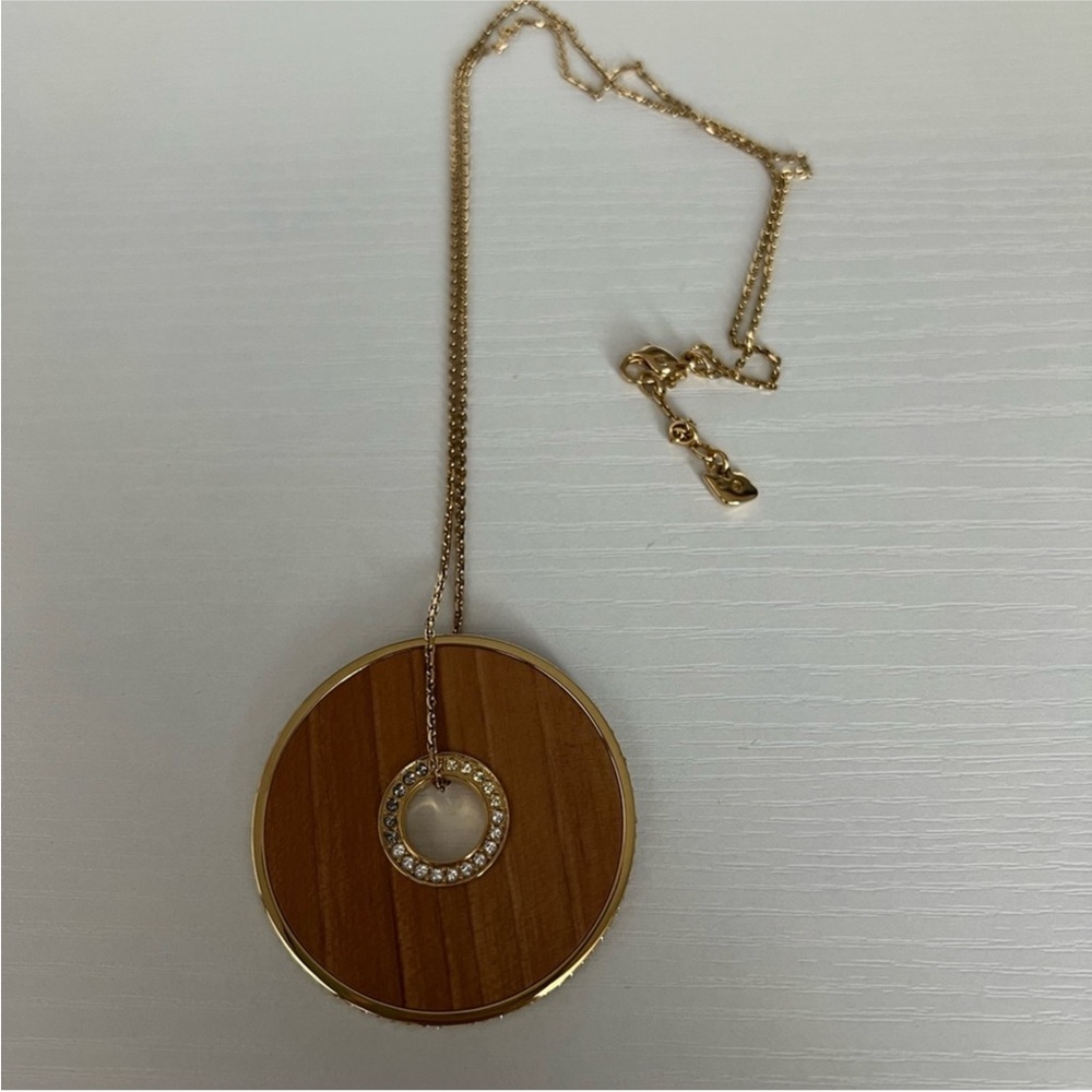 Swarovski Elegant Gold and Brown Circle Pendant Necklace